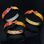 „Dream“-Armband aus orangefarbener Keramik mit Regenbogenfarben